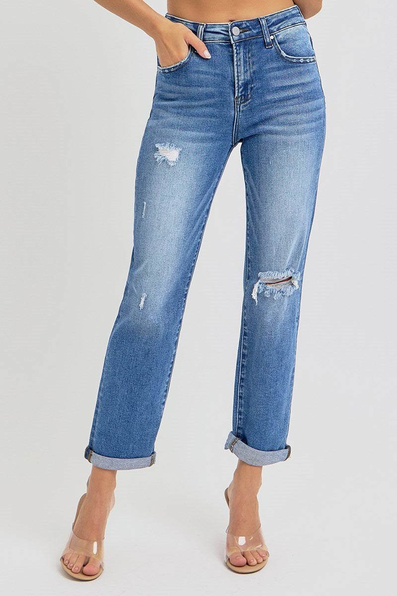 Model wearing Risen high rise relaxed jeans with rolled cuff